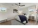 Serene bedroom with ample natural light, stylish furnishings, and a cozy atmosphere at 3552 Cedarvale Ct, Powder Springs, GA 30127