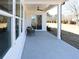 Covered patio with ceiling fan, features plenty of light and a lovely view of the yard at 3552 Cedarvale Ct, Powder Springs, GA 30127