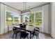 Bright dining room with hardwood floors and a large window at 3552 Cedarvale Ct, Powder Springs, GA 30127