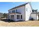 Side view of this bright, two-story home, with a view of an unfinished lawn and siding at 3552 Cedarvale Ct, Powder Springs, GA 30127