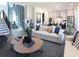 Open-concept living space seamlessly connecting the living room, dining area, and kitchen at 3552 Cedarvale Ct, Powder Springs, GA 30127