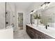 Main bathroom with double vanity, glass shower, and modern decor at 3552 Cedarvale Ct, Powder Springs, GA 30127