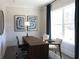 Bright and airy home office with a modern desk and a large window providing abundant natural light at 3552 Cedarvale Ct, Powder Springs, GA 30127