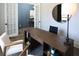 Stylish home office featuring a built-in desk, modern decor, and ample natural light, perfect for productivity at 3552 Cedarvale Ct, Powder Springs, GA 30127