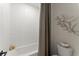 Clean and functional shower area featuring white subway tiles and modern fixtures at 3552 Cedarvale Ct, Powder Springs, GA 30127