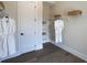 A walk-in closet features wire shelving and two white robes at 3552 Cedarvale Ct, Powder Springs, GA 30127