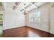 Elegant dining room with coffered ceiling, wainscoting, and hardwood floors at 5705 Aspen Dr, Cumming, GA 30040