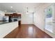 Bright kitchen with granite countertops, stainless steel appliances, and hardwood floors at 5705 Aspen Dr, Cumming, GA 30040