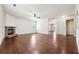 Expansive living room featuring hardwood floors and a stone fireplace at 5705 Aspen Dr, Cumming, GA 30040