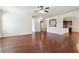 Open-concept living area with hardwood floors and seamless flow to the kitchen at 5705 Aspen Dr, Cumming, GA 30040