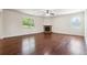 Spacious living area with a stone fireplace and hardwood flooring at 5705 Aspen Dr, Cumming, GA 30040