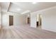 Spacious main bedroom with tray ceiling and multiple doorways at 5705 Aspen Dr, Cumming, GA 30040