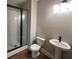 Bathroom featuring a glass shower and pedestal sink at 968 Bibbs Circle Nw, Atlanta, GA 30318