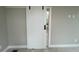 Stylish white barn door with black hardware adds a modern touch to the space at 968 Bibbs Circle Nw, Atlanta, GA 30318