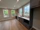 Well-lit kitchen featuring sleek gray cabinets, stainless appliances, and hardwood floors at 968 Bibbs Circle Nw, Atlanta, GA 30318