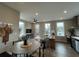 Open-concept living space with hardwood floors, modern lighting, and a cozy seating area at 968 Bibbs Circle Nw, Atlanta, GA 30318