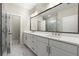 Bathroom featuring double sink vanity, and glass shower at 1417 Coretta Scott Bnd, Atlanta, GA 30318