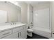 Bright bathroom with subway tile shower/tub and modern vanity with white countertop at 1417 Coretta Scott Bnd, Atlanta, GA 30318