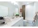 Bathroom featuring a shower-tub combo, modern vanity, and decorative accents at 1417 Coretta Scott Bnd, Atlanta, GA 30318
