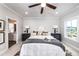 Bright bedroom featuring a ceiling fan, neutral decor, and plenty of natural light at 1417 Coretta Scott Bnd, Atlanta, GA 30318