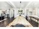 Bright dining area open to kitchen with hardwood floors at 1417 Coretta Scott Bnd, Atlanta, GA 30318