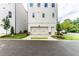 Exterior shot showcasing the garage and front entrance of a modern townhome at 1417 Coretta Scott Bnd, Atlanta, GA 30318