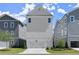 New townhome exteriors featuring neutral siding and manicured lawns at 1417 Coretta Scott Bnd, Atlanta, GA 30318