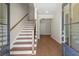 Welcoming foyer featuring hardwood floors and a staircase at 1417 Coretta Scott Bnd, Atlanta, GA 30318