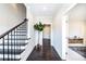 Bright foyer with dark hardwood floors and staircase at 1417 Coretta Scott Bnd, Atlanta, GA 30318