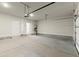 A spacious two-car garage with a clean, concrete floor and plenty of overhead lighting at 1417 Coretta Scott Bnd, Atlanta, GA 30318