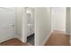 Hallway view of powder room featuring modern finishes, sleek design and hardwood flooring at 1417 Coretta Scott Bnd, Atlanta, GA 30318