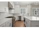 Modern kitchen with stainless steel appliances, white cabinets, and center island at 1417 Coretta Scott Bnd, Atlanta, GA 30318