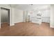 Open-concept kitchen with white cabinetry, a kitchen island, and stainless steel appliances at 1417 Coretta Scott Bnd, Atlanta, GA 30318