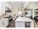 Open concept kitchen with stainless steel appliances and large island at 1417 Coretta Scott Bnd, Atlanta, GA 30318