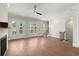 Living room with wood floors, fireplace, ceiling fan, and french doors at 1417 Coretta Scott Bnd, Atlanta, GA 30318