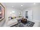 Cozy living room with a comfortable sectional couch and natural light at 1417 Coretta Scott Bnd, Atlanta, GA 30318