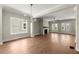 The expansive living room boasts hardwood floors, fireplace and lots of natural light from the large windows and French doors at 1417 Coretta Scott Bnd, Atlanta, GA 30318