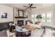 Living room showcasing a stone fireplace and a ceiling fan at 1417 Coretta Scott Bnd, Atlanta, GA 30318