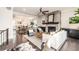 Open-concept living room with a stone fireplace at 1417 Coretta Scott Bnd, Atlanta, GA 30318