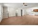 Open floor plan showcases hardwood floors, stairs, and seamless flow to the adjacent kitchen with a large island at 1417 Coretta Scott Bnd, Atlanta, GA 30318