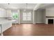 Open-concept kitchen with white cabinetry and stainless steel appliances overlooking living area at 1417 Coretta Scott Bnd, Atlanta, GA 30318