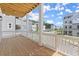 Relaxing porch overlooking the street features a wood ceiling and white railing with views of the community at 1417 Coretta Scott Bnd, Atlanta, GA 30318