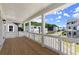 Covered porch featuring wood flooring and white railings with lovely neighborhood views at 1417 Coretta Scott Bnd, Atlanta, GA 30318