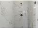 Walk-in shower with white marble tile and a rainfall showerhead at 1417 Coretta Scott Bnd, Atlanta, GA 30318