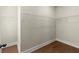 Walk-in closet with white wire shelving and hardwood floors at 1417 Coretta Scott Bnd, Atlanta, GA 30318