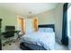 Bedroom with light yellow walls, black furniture, desk, and black out curtains at 2025 Goldmine Dr, Cumming, GA 30040