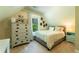 Cozy bedroom featuring neutral walls, carpet, and a sunny window view of the backyard at 2025 Goldmine Dr, Cumming, GA 30040