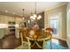 Cozy dining room with a table for four and a view of the modern kitchen at 2025 Goldmine Dr, Cumming, GA 30040