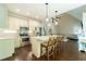 Stylish kitchen with stainless steel appliances, kitchen island, and modern barstools at 2025 Goldmine Dr, Cumming, GA 30040