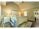 Bright main bedroom featuring large bed, hardwood floors, and walk-in closet access at 2025 Goldmine Dr, Cumming, GA 30040